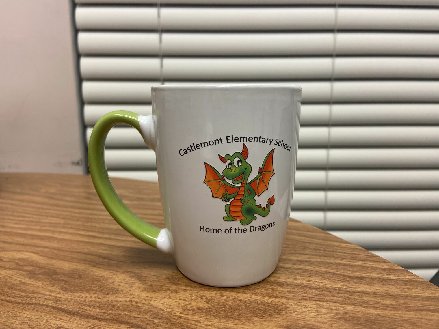 coffee mug with a cartoon dragon design
