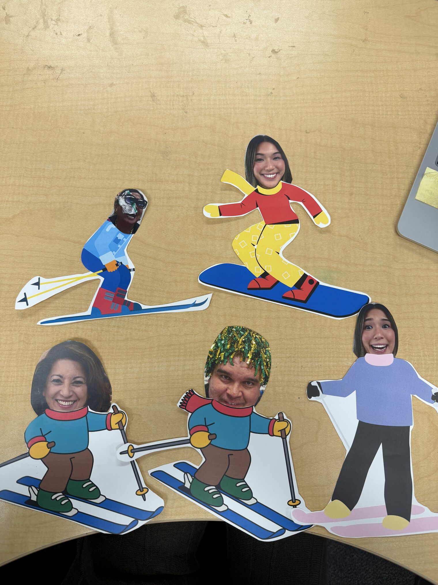Comic skiers with human photo heads