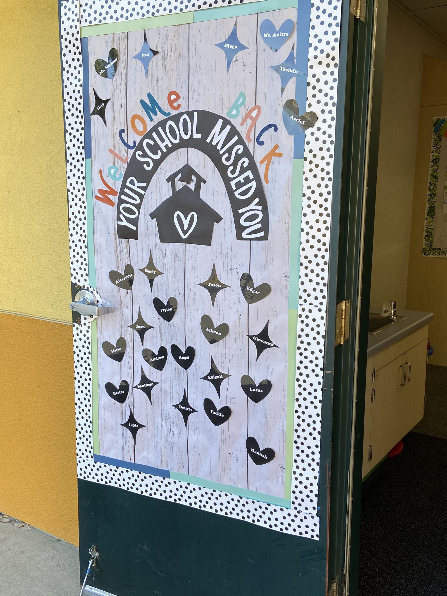 Classroom door with " we missed you" message