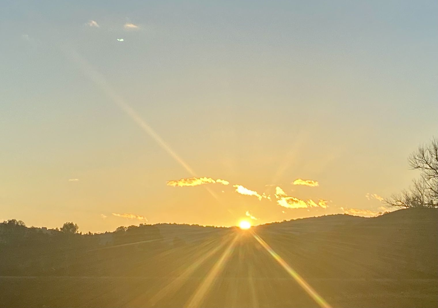 SUNSET BEHIND HILLS