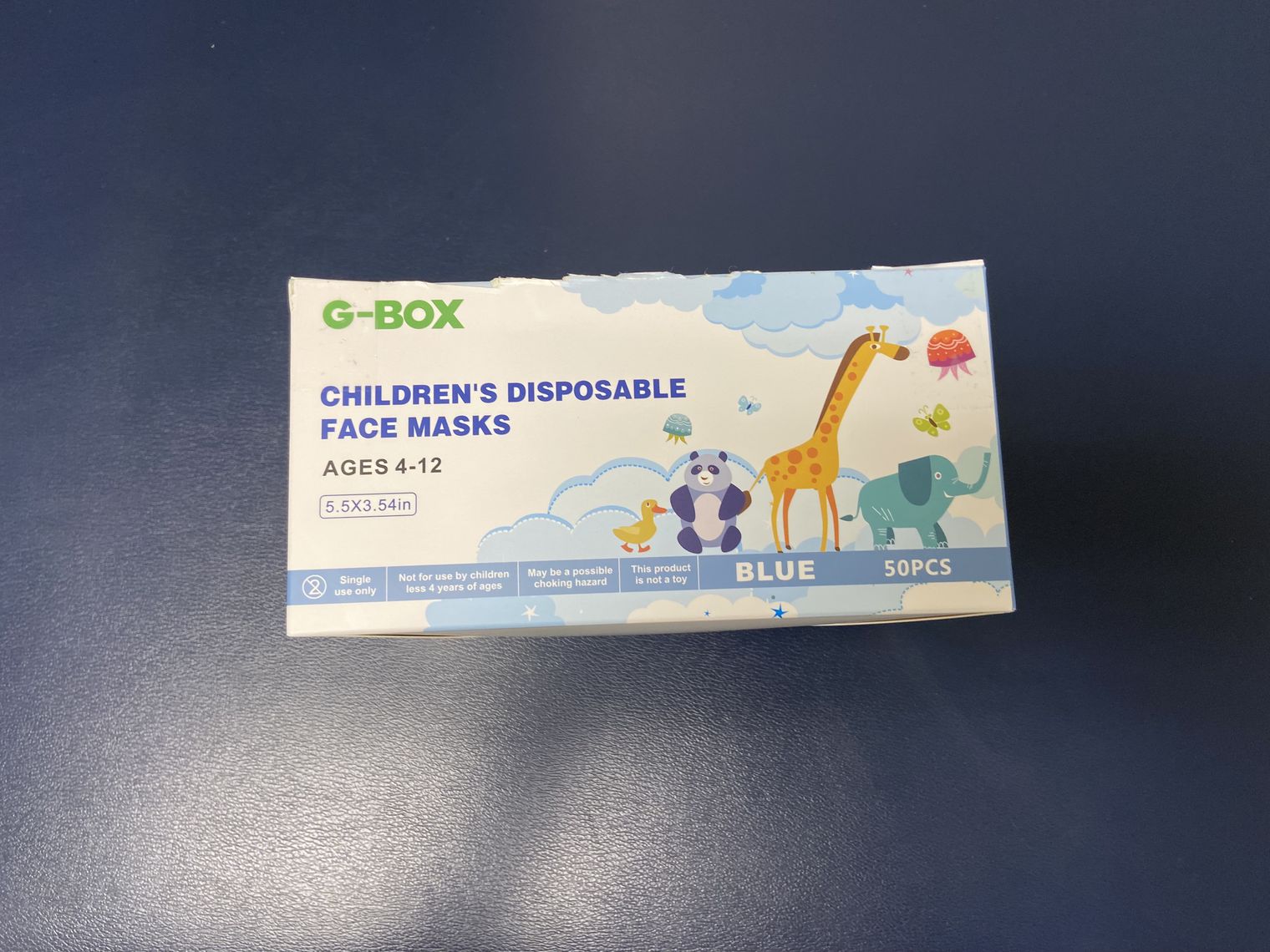 A box of childrens disposable face masks