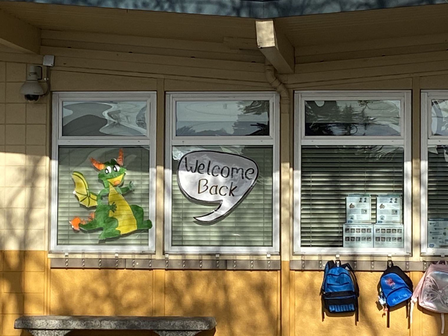 Classroom windows with dragon poster.