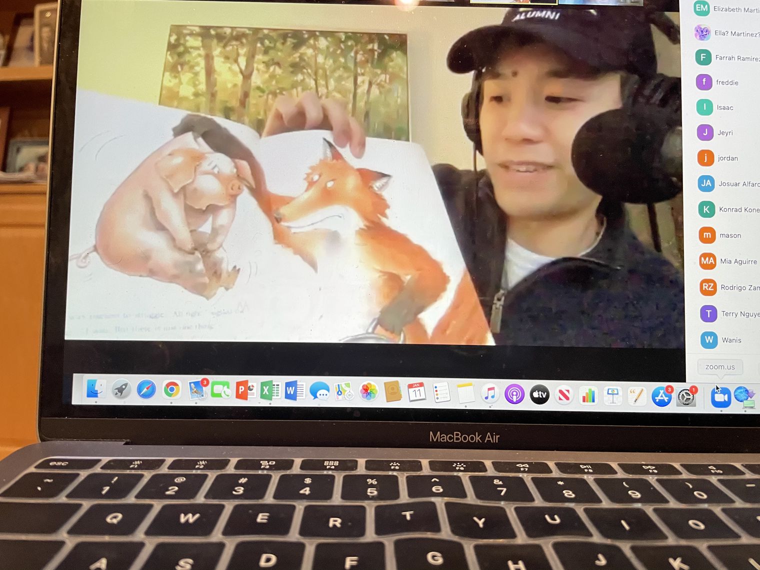 Mr. Nguyen reading a book on a computer screen.