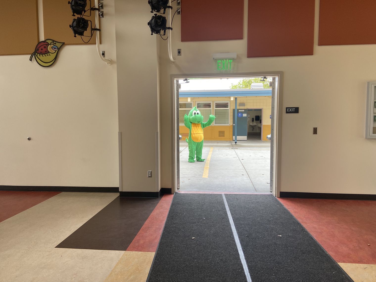 Dragon mascot in a doorway
