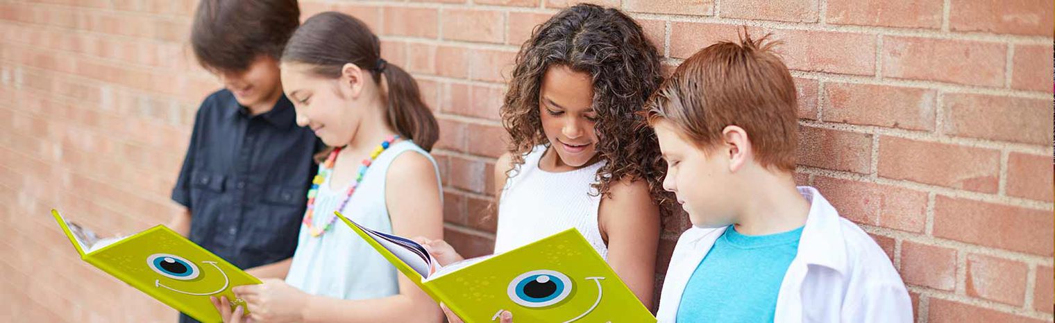 Children looking at yearbooks