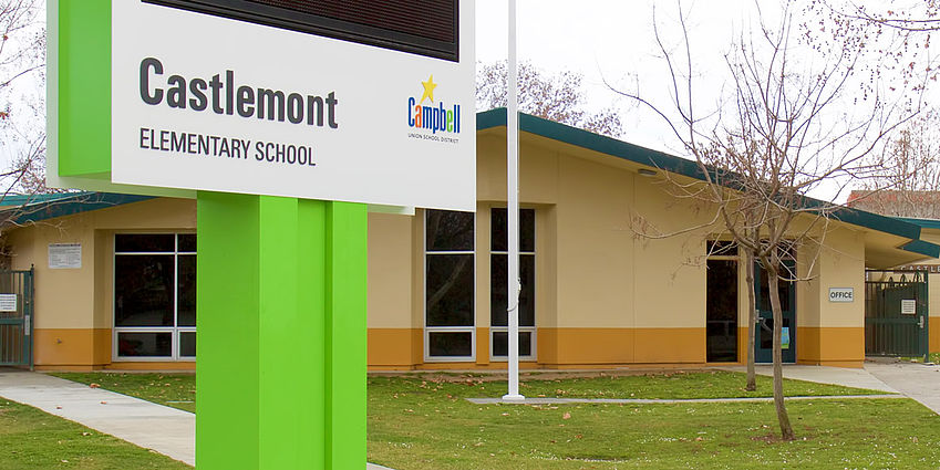 Front of Castlemont Elementary School including the school message board sign.