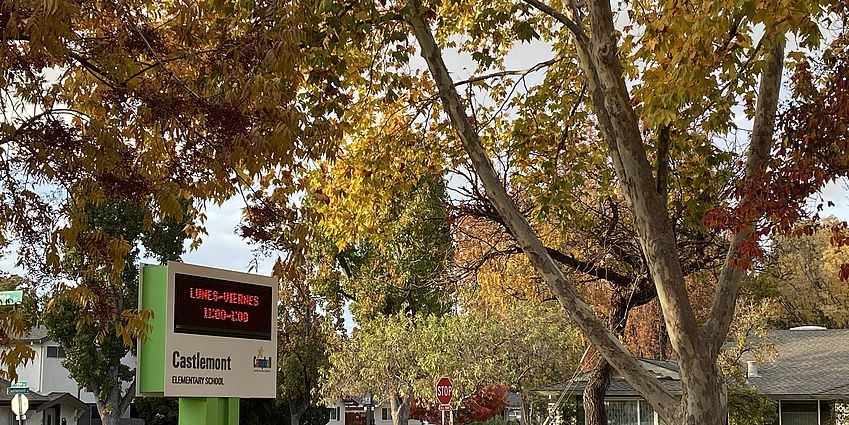 Castlemont School sign and autumn trees