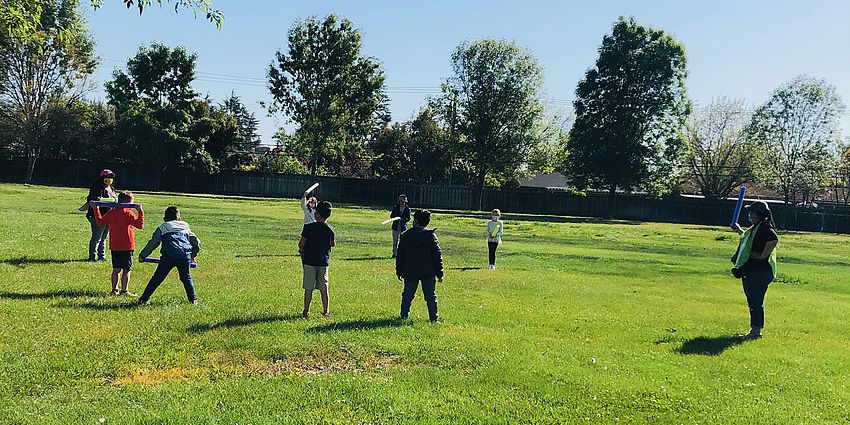 Children playing on a grassy field