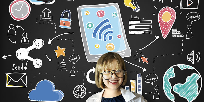 girl stands in front of board with internet symbols