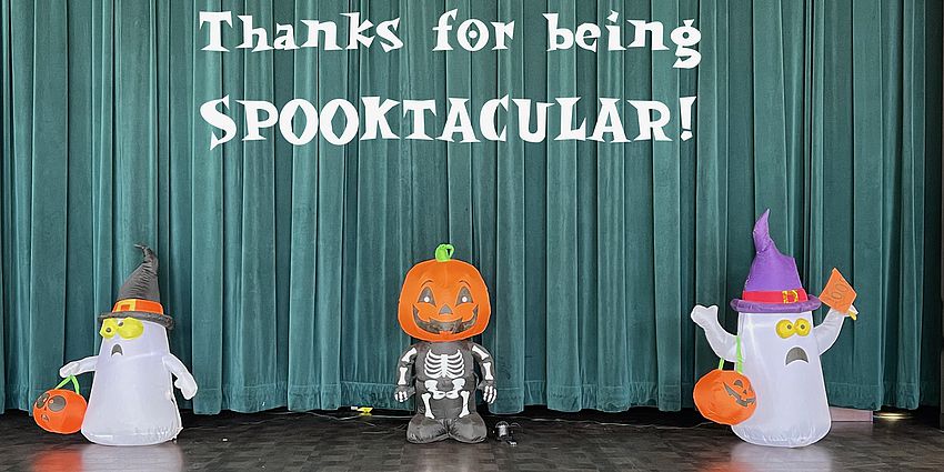Ghost, Jacalanter on school stage with a note. "Thanks for being Spooktacular!"