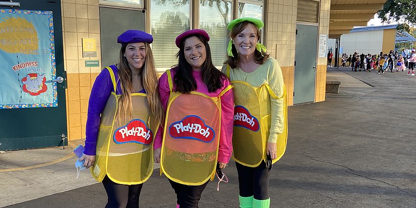 Three teachers dressed up as Play-doh