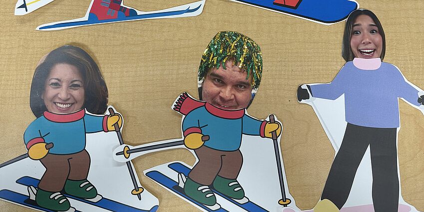 Comic skiers with human photo heads