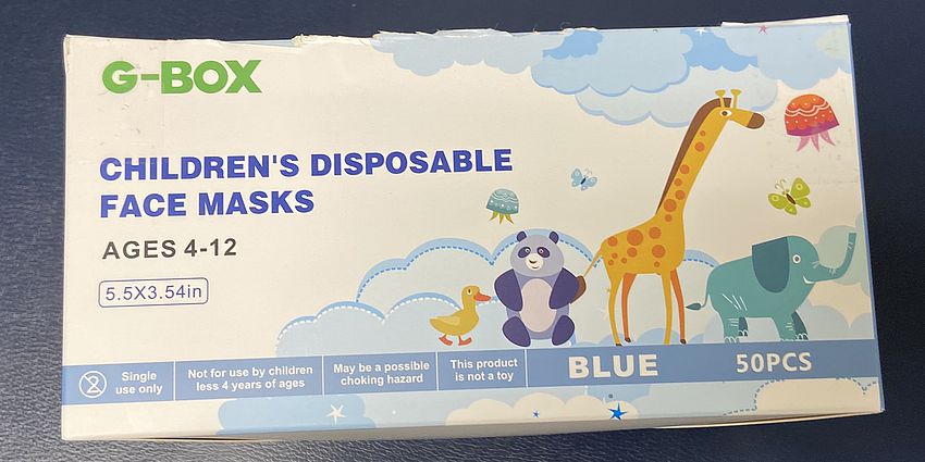 A box of childrens disposable face masks