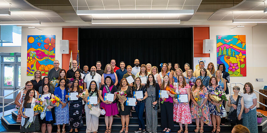 Honorees from the May 2026 staff and volunteer recognition ceremony