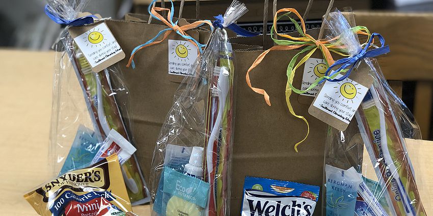 brown gift bags and packaged snacks