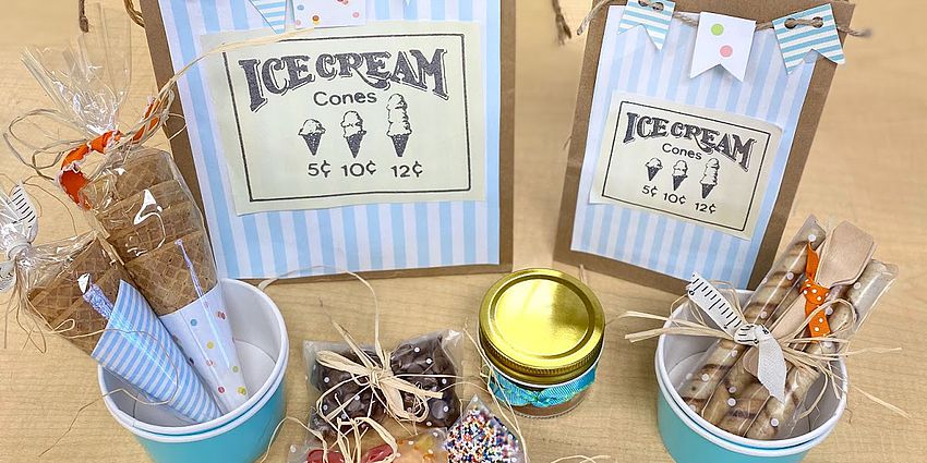 Two paper bags decorated with ice cream cones