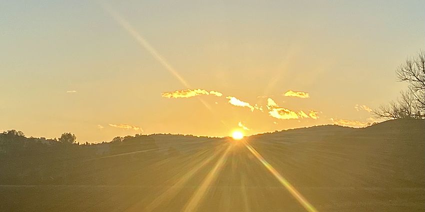 SUNSET BEHIND HILLS