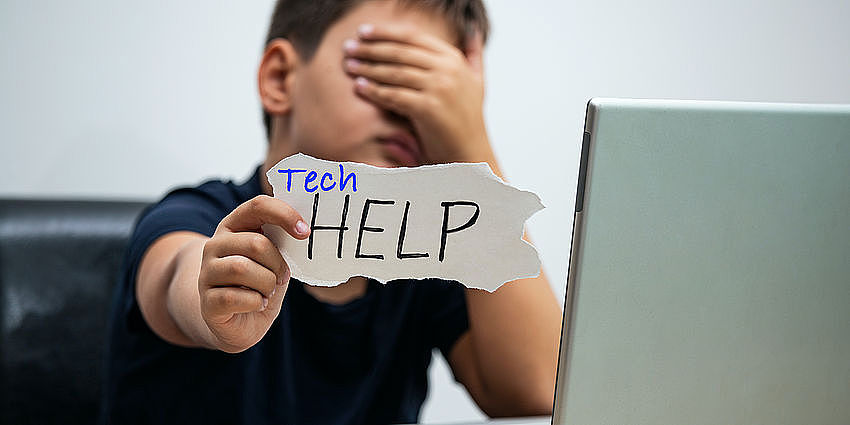 child with techhelp sign