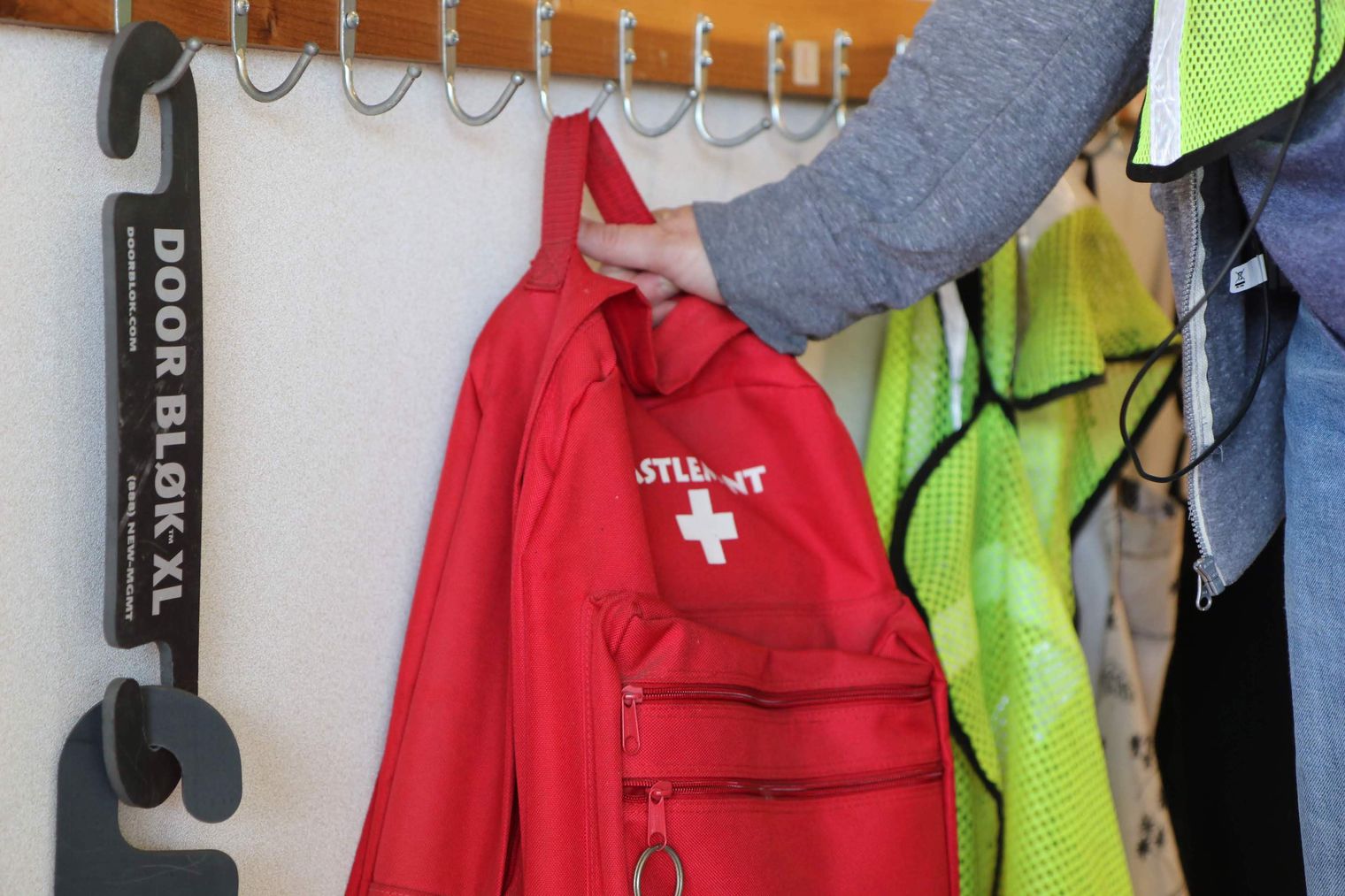 hand reaching for emergency backpack
